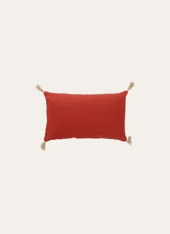 COUSSIN EN COTON UNI AVEC POMPONS EN JUTE ROUILLE