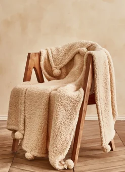PLAID EN SHERPA AVEC FINITIONS POMPONS BEIGE