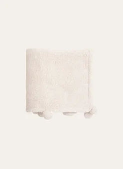 PLAID EN SHERPA AVEC FINITIONS POMPONS ÉCRU