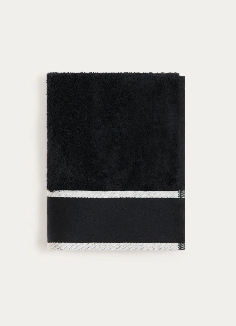 SERVIETTE DE TOILETTE UNIE À LARGE BORDURE ARTHUR Noir