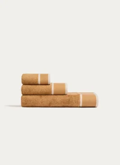 SERVIETTE DE TOILETTE UNIE À LARGE BORDURE ARTHUR CARAMEL